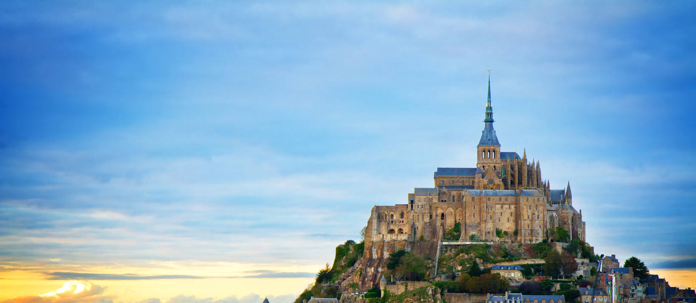 Mont St Michel city at sunset, Brittany France, toned