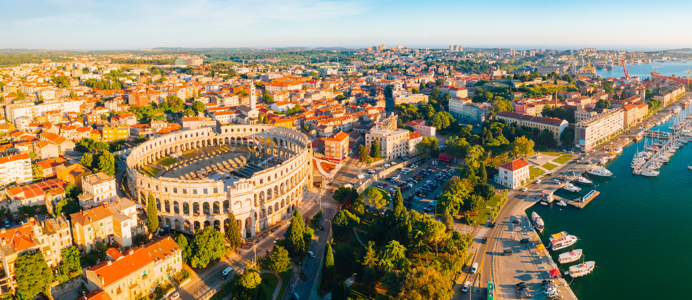 Aerial drone photo of famous european city of Pula and arena of roman time. Location Istria county, Croatia, Europe. Popular touristic place. UNESCO world heritage site. Discover the beauty of earth.